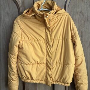 Cotton On Outdoor Puffer Jacket in a mustard yellow color